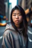 Placeholder: Beautiful young Asian woman wearing an oversized sweatshirt, standing in New York, hyper realistic, detailed face