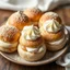 Placeholder: A full-view image of freshly baked Semlor buns 🇸🇪 filled with whipped cream 🍶 and almond paste 🌰 on a plate.