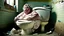 Placeholder: big lady sits on crumbling toilet