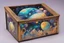 Placeholder: a box for storing things with beautiful drawings a lot of colours, very detailed, angels, minerals, planets space, galaxies, pyramids on a planet