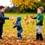 Placeholder: boy and girl catching leaves