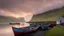 Placeholder: Painted fishermen’s boats anchored in a harbour in the Faroe Islands near a fishing village, fishermen putting fishing nets on their boats, peaceful, mist in the distance over the calm sea, early morning, sunrise, beautiful romantic photograph, excellent composition, atmospheric, realistic