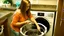 Placeholder: very confused young woman places a few metal spoons into her household dryer