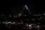 Placeholder: Downtown Memphis in a dystopian future at night, city skyline, Pyramid