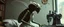 Placeholder: Xixchil Insectoid alien surgeon covered in bizarre biological modifications and extra limbs. Sewing machine, banana Keeps offering completely unnecessary “improvements.” in 2590s apartment and clothes