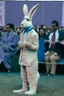 Placeholder: 1990 human show the winner is a "half human rabbit combined animal::40", realistic (film Color Mission 200::10) photo from old disposable camera , grainy photo, large suit