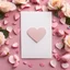 Placeholder: A photo of a white card, 5.5 by 4.25 inches. The card is vertically positioned on a beautiful light pink surface, positioned between pink rose petals and litte golden hearts.