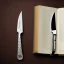 Placeholder: shiny fork and knifes on dinner table with cloth, book cover