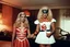 Placeholder: [vintage style noisy scratches glitches, Shot the texture and then rewound the film and double exposed from a colorful 1970s Italian movie] As the hot blonde cheerleader and the xenomorph mummy faced each other in the eerie hotel room, a palpable tension filled the air. The cheerleader, her youthful exuberance contrasting with the mummy's ancient horror, stood poised for a confrontation unlike any other. The xenomorph mummy, a fusion of unearthly terror and decaying majesty, regarded the cheerle