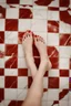 Placeholder: perfect picture of a woman's 5 toes with marble floor as background and red nail polish