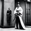 Placeholder: [photo by helmut newton] The guardian stands tall, Kimono turned combat gear, Beauty wields power. A weapon in each hand: Skillful hands at work,Firearm and blade in balance, Enforcer's resolve. Her strength emanates, Ancient grace meets modern might, she attacks