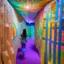 Placeholder: Create a tunnel-like structure within the labyrinth using hanging textiles. Use fabrics with contrasting colors and textures to represent different stages of your journey. As visitors walk through the tunnel, they can physically feel and see the transformative journey unfold around them.