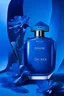 Placeholder: Dior perfume advertisement, blue background, real photography