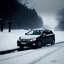 Placeholder: a picture of a landscape with deep snow and a very bad snowstorm goin, and a dark grey 2010 Hyundai i30 crdw classicwith a snow flurry moundted on the front, driving through deep snow, and all the snow from the road is removed by the snow flurry