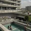 Placeholder: Several people of different genders, ages and races participate in different activities on the balconies and ledges of a brutalist concrete building with a swimming pool at the bottom, overlooking a dense urban city