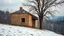 Placeholder: a lonely old adobe hut with worn adobe brown-gray wall and a small window, a crumbling roof, an old chimney stands on a hill, next to it is a small woodshed by the wall, and an old withered tree leans over the hut, the hut stands on the edge of a European forest, winter, snowy landscape, low light, dawn, high detailed, sharp focus, high realistic, perfect photo