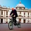 Placeholder: Pope riding bicycle, Rome, St Peter's basilica, photo realistic, 8k