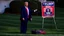 Placeholder: trump 2024 campaign signs all over lawn while manly woman screaming on phone