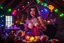 Placeholder: Glowing voluptuous Halloween vampire bimbo woman having a tea party in the haunted house attic. Colorful string lights and festive decorations create a spooky magical atmosphere