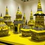 Placeholder: A yellow town made out of hats designed in Javanese shadow puppets painted by Roy Lichtenstein