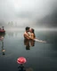 Placeholder: Portrait Romantic European couple swimming kissing together in lake Wonderful landscape fantasy early morning heavy fog photography art Rivendell village,lake,magical forest and houses,beautiful mushrooms,roses flowers,little waterfall,lake,close up photo beautiful romance couples on swimming together in lake