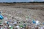 Placeholder: A photo of a landfill or waste disposal site to represent the issue of non-recyclable filters.