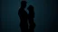 Placeholder: one athletic man silhouette standing very close to one woman silhouette against a modern wall. He leans toward her confidently, one arm resting against the wall beside her. Woman looks up at him, her face mostly hidden. romantic tension,. His face is partly in shadow,, fit build, black fitted shirt. Dark indistinct background, black, charcoal, and deep tones, cinematic