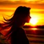 Placeholder: Silhouette of the head of a young lady with long flowing hair in a slight breeze. At sunset in Czech nature.