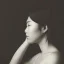 Placeholder: moody charcoal side profile portrait of an asian woman in her 30s, side on profile, studio photography, artistic black and white profile photograph, delicate, highly detailed, chiaroscuro, beautiful composition, delicate arrangement, aesthetic, soft lighting, tender