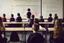 Placeholder: class of children's students, view from the back of the class, looking at the blackboard, students sitting at their desk and a student writing on the blackboard, real photography, reality, photojournalism