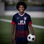 Placeholder: 85mm DSLR color photography of a very detailed headshot fitting all of head and hair in frame. 20-year-old USA soccer player, with black hair color and with small facial hair and has a brown skin tone and has a small afro with a small smile, grey background