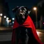 Placeholder: Imagen de un perro negro, tamaño mediano, super héroe, con un disfraz con capa roja, de noche, en una calle bien iluminada, primer plano.