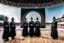 Placeholder: a group of men standing next to each other, female dancer, softair arena landscape, made in 2019, black pointed hat, olympics ceremony, islamic interior design, exhibition display, panorama shot, magic uniform, by Siona Shimshi, woodlands style, 2019, caravagio, general uniform, ymmetrical