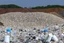 Placeholder: A photo of a landfill or waste disposal site to represent the issue of non-recyclable filters.