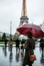 Placeholder: around Eiffel tower a few people with umbrella walking while it is raining and the Eiffel is seen complete,a pertty lady with nice umbrella is comming to camera