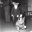 Placeholder: Creepy old photo of new years eve party with monster cat