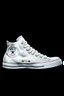 Placeholder: A converse sneaker, covered in Dallas cowboys theme