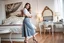 Placeholder: very beautiful sexy lady with beautful gray midi skirt and blouse standing in a luxury bedroom with high heels next to makeup desk looking to camera