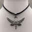 Placeholder: necklace with a simple, elegant design featuring a single, shimmering polyester in dragonfly pendant