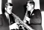 Placeholder: John f kennedy playing A normal saxophone with his eyes closed