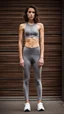 Placeholder: photography of a beautiful anorexic woman, grey satin triathlon top, brunette wavy pixie haircut, pronounced sternum, flat chest, grey satin cycling leggins