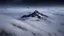 Placeholder: looking down from space at only one single sharp misty mountain cliff coming through the mist and surrounded by the mist at night starry sky. There is crucially only one mountain, do not paint more other peaks in the background.