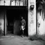 Placeholder: [photo shoot of Sandokan by Sergio Sollima, (1976)] In the gritty streets of Alabama, where the humid air hung heavy with the scent of sweat and secrets, a lone figure stands before the weather-beaten door of a rundown motel. The silhouette of the Dharma Bum, a former gangsta covered by tattoos. To the untrained eye, it was just another shabby building in a forgotten corner of the city. But to those in the know, it was a temple of sorts, a sanctuary for those seeking solace in the chaos of urban