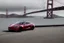 Placeholder: A Tesla 'Model S' is parked, on the 'Golden Gate' bridge. (CINEMATIC, WIDE ANGLE LENS, PHOTO REAL)