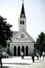 Placeholder: quintessential church with steeple with people walking out of it with the label "domestic terrorists"