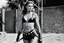 Placeholder: [photo by helmut newton in agent provocateur on the arena] Her complexion, after years spent training under the sun, bore the mark of a warrior who had weathered countless battles. Though her face spoke of hardship, there was also an air of grace and serenity that emanated from her every pore. Selene's physique was a testament to her dedication and discipline. Her muscular frame hinted at her physical prowess, yet her movements were fluid, as if she danced with the wind itself.