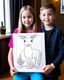 Placeholder: Check out a picture of A girl AND A boy (4 years) showcasing their finished deer coloring page in a frame or as a gift for someone special.