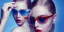 Placeholder: Scarlett Leithold intense red lips with green glasses backlit blue