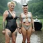 Placeholder: [photo by Evelyn Hofer] Tattooed Tank Girl and Madonna as middle age ladies wearing swimsuits caught in a heavy summer rain in central park, happy with no inhibitions
