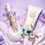 Placeholder: a bottle for cosmetics and a cream jar lies on a beautiful floral background top view, in the background there are beautiful spring flowers and a drop of cream, high-quality picture, top view